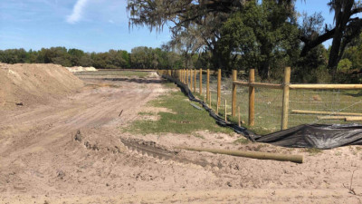 Fence installation near pond -- March 2020
