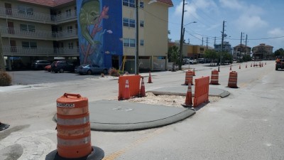 Concrete pedestrian island on SR 699 (April 2026 photo)