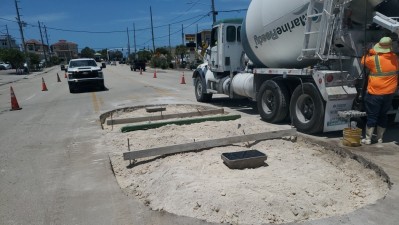 Crews construct concrete pedestrian island (April 2026 photo)