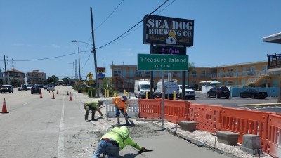 Crews construct concrete sidewalk and curb (April 2026 photo)