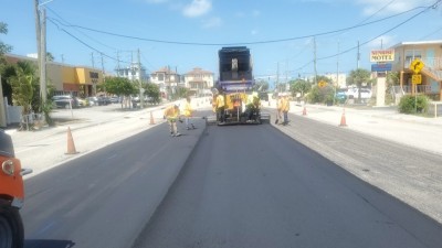 Looking west as crews repave SR 699 (May 2026 photo)