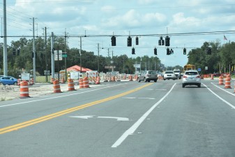 Looking west on SR 54 from the Eiland Blvd. / Morris Bridge Road intersection at construction of new eastbound lanes on the south side of the corridor (10/11/2022 photo)