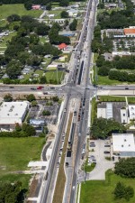 Looking west over SR 54 at the Morris Bridge Rd. / Eiland Blvd. intersection (7-19-2023 photo)