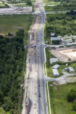 Looking west over SR 54 towards Meadow Pointe Drive at the top of the photo (7/15/2021 photo)