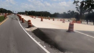 Transition from asphalt roadway to concrete roadway approaching US 301 (8/17/2021 photo)