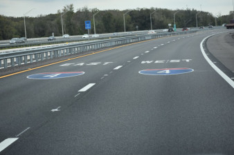 The long ramp has plenty of pavement markings to help drivers choose the correct lane to go east or west on I-4.