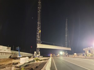 The first concrete beam is lifted and ready to be placed over southbound I-75 (10/15/2021 photo)