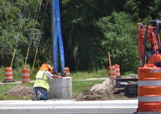 Installation of a pole foundation on the south side of Overpass Road (photo 7/6/2022)