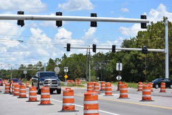 Looking southeast on Overpass Road at Boyette Road, where signals are expected to be activated by late summer 2022 (photo 7/6/2022)