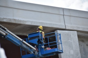 Finishing work on the westbound Overpass Road bridge that will carry traffic onto southbound I-75 (10/11/2022 photo)