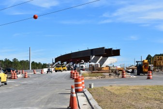 Looking east on Overpass Road at construction of the flyer bridge that will carry westbound traffic onto southbound I-75 (1/24/2022 photo)