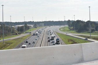 Looking south over I-75 from the flyover bridge that will carry traffic from westbound Overpass Road onto southbound I-75 (12/12/2022 photo)