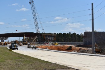 One span remains to be set for the steel girders for the westbound Overpass Road bridge onto southbound I-75  (photo 2/21/2022)