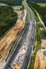 Looking north over I-75 at construction of the interchange on the north side of Overpass Rd. (8/17/2021 photo)