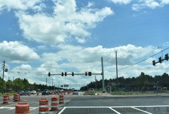 Looking east on Overpass Road at the new traffic signals at Boyette Road (8/15/2022 photo)