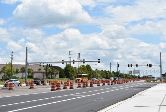 Looking northeast on Overpass Road at the new traffic signals at Boyette Road (8/15/2022 photo)