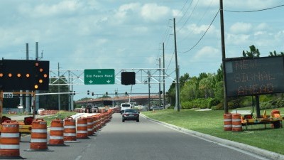 Electronic sign alerts drivers to the new traffic signal at Overpass Road / Boyette Road (8/15/2022 photo)