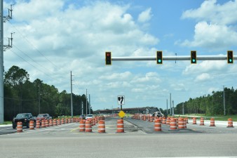 Looking west on Overpass Road at the new traffic signals at Boyette Road (8/15/2022 photo)