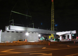 A large steel girder is being lifted into place during construction of a Gateway Expressway bridge over Ulmerton Road (Feb. 2020 photo)