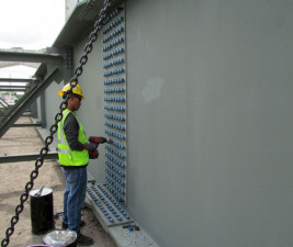 A worker tightens bolts on a 71/2 foot high steel girder (Feb. 2020 photo)