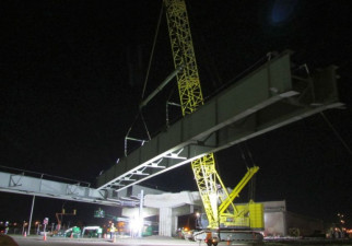 A pair of large steel girders are lifted into place over Ulmerton Road (Feb. 2020 photo)