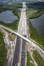 Looking southwest over I-275 at reconstruction of the southbound exit ramp and bridge to 4th Street N. (7-14-2023 photo)