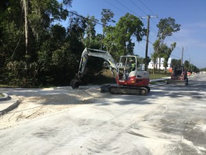 Grading driveway base material on new SR 52 (Clinton Avenue) near Orangewood Drive (3-6-2023 photo)