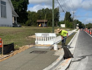 Installation of sidewalk and ADA ramp at Clinton Avenue (new SR 52) and Cove Lane (4-10-2023 photo)