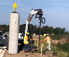 Installing a light pole foundation along the new alignment of SR 52 (5/25/2021 photo)