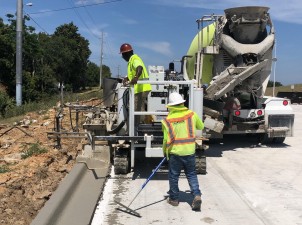 Installing concrete curb along the new SR 52 alignment (5/25/2021 photo)