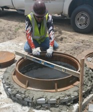 Installing a manhole cover (6/22/2021 photo)