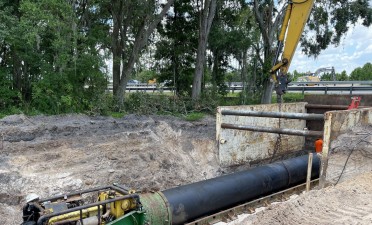 A jack and bore operation to install a drainage pipe under existing SR 52 near the west end of the project (6/9/2021 photo)