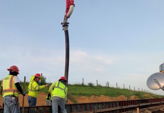 Placing concrete for a wall along new SR 52 (7/13/2021 photo)