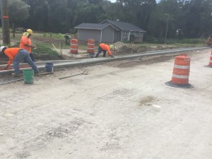 Installing curb along the new SR 52 alignment by Orangewood Drive (9/8/2021 photo)