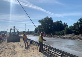 Placing concrete for the new SR 52 roadway (May 2021 photo)