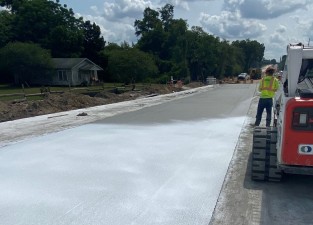 Curing concrete pavement on new westbound SR 52, east of Prospect Road (5/19/2022 photo)