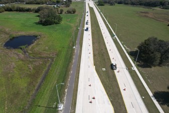 Looking east at traffic on the new alignment of SR 52 approaching Curley Road (2/20/2023 photo)