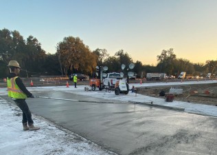 Finishing concrete pavement at the intersection of Clinton Ave. and Prospect Rd. (2/16/2022 photo)