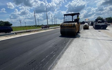 Placing asphalt west of Corporate Lake Blvd. (5/23/2022 photo)