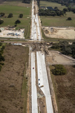 Looking east over new SR 52 concrete road paving at Curley Road intersection (2/15/2021 photo)