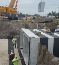 Setting a precast section of box culvert at Bayou Branch (2/8/2022 photo)