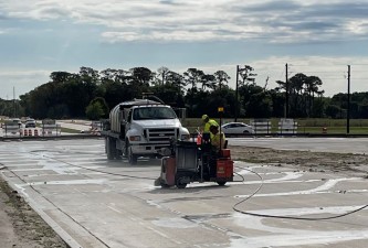 Saw-cutting and pressure washing concrete joints before applying sealant (3/16/2022 photo)