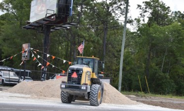 Moving lime rock for construction of the trail base (5/6/2021 photo)