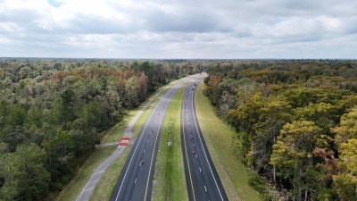 Traffic is now one lane in each direction and separated by the median as final paving takes place (10-28-2025 photo)