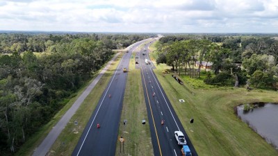 Traffic is now one lane in each direction and separated by the median as final paving takes place (10-28-2025 photo)
