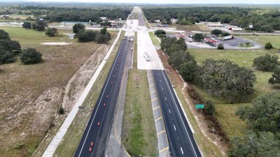 Traffic is now one lane in each direction and separated by the median as final paving takes place (10-28-2025 photo)