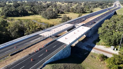 Looking southwest over SR 50 at the bridges over the railroad tracks (10-31-2025 photo)