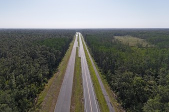 Looking east over SR 50 at mostly-completed roadway towards the east end of the project (4-29-2025 photo)