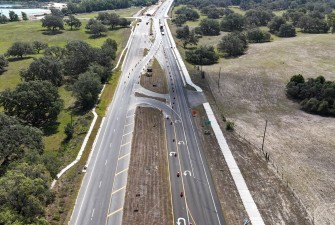 Looking east over SR 50 at the temporary roadway transition east of US 301 from divided to undivided highway (4-29-2025 photo)