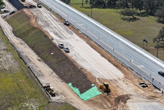 Looking southeast over SR 50 at construction of new westbound roadway (4-29-2025 photo)